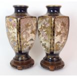 A pair of Satsuma square shaped vases painted with panels of birds amongst wisteria rhododendrons