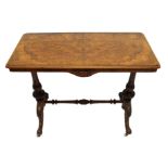 A Victorian walnut rectangular occasional table on baluster and scroll end supports joined by a