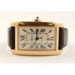 A gents Cartier 18ct rose gold automatic watch the case is tank shaped, dial is cream sunburst