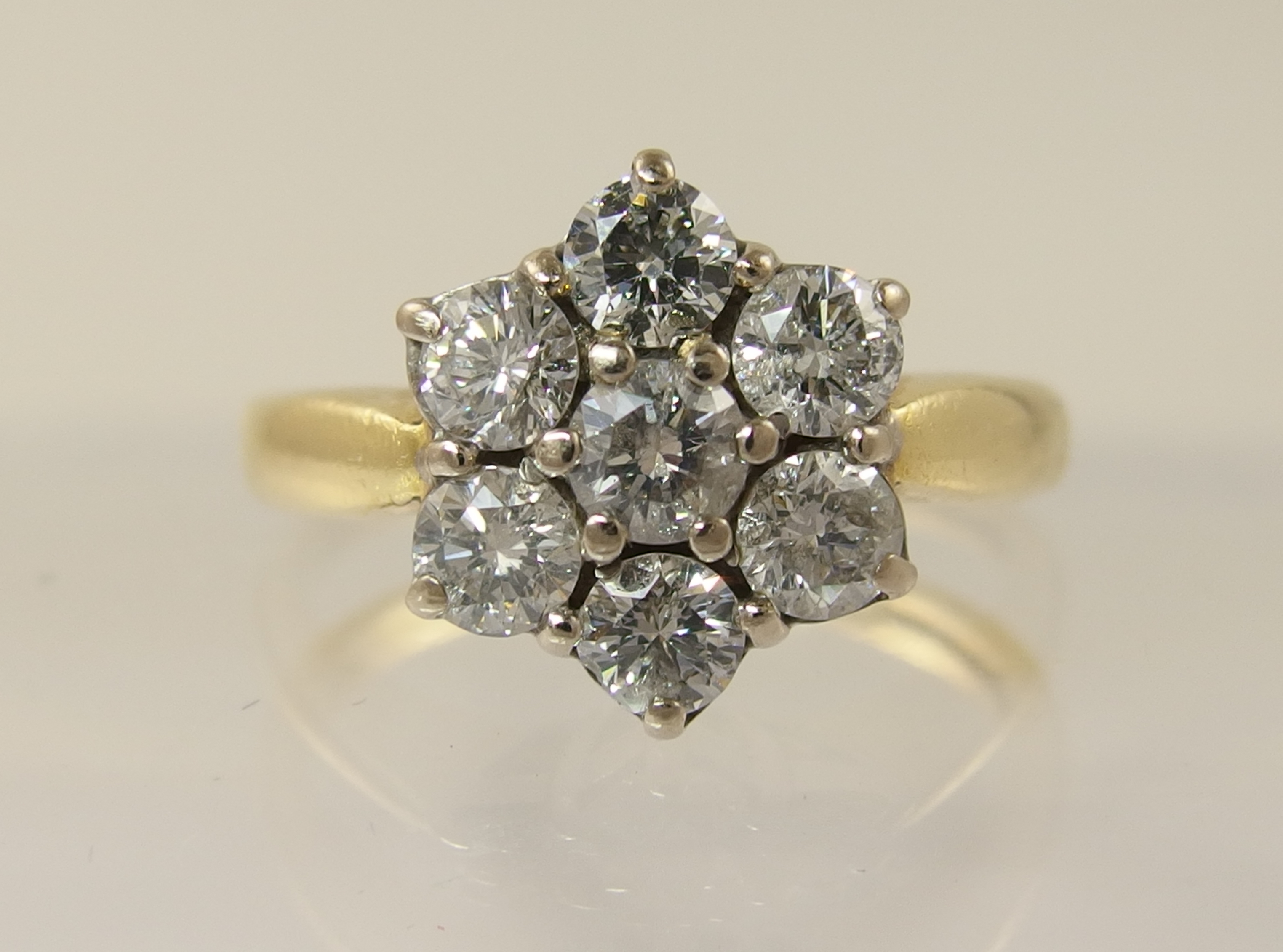 An 18ct diamond daisy cluster ring with an approximate diamond total of 0.80cts, finger size M. - Image 5 of 7