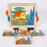 A Clarice Cliff Bizarre "Orange Roof Cottage" pattern smoker's set circa 1932, comprising match