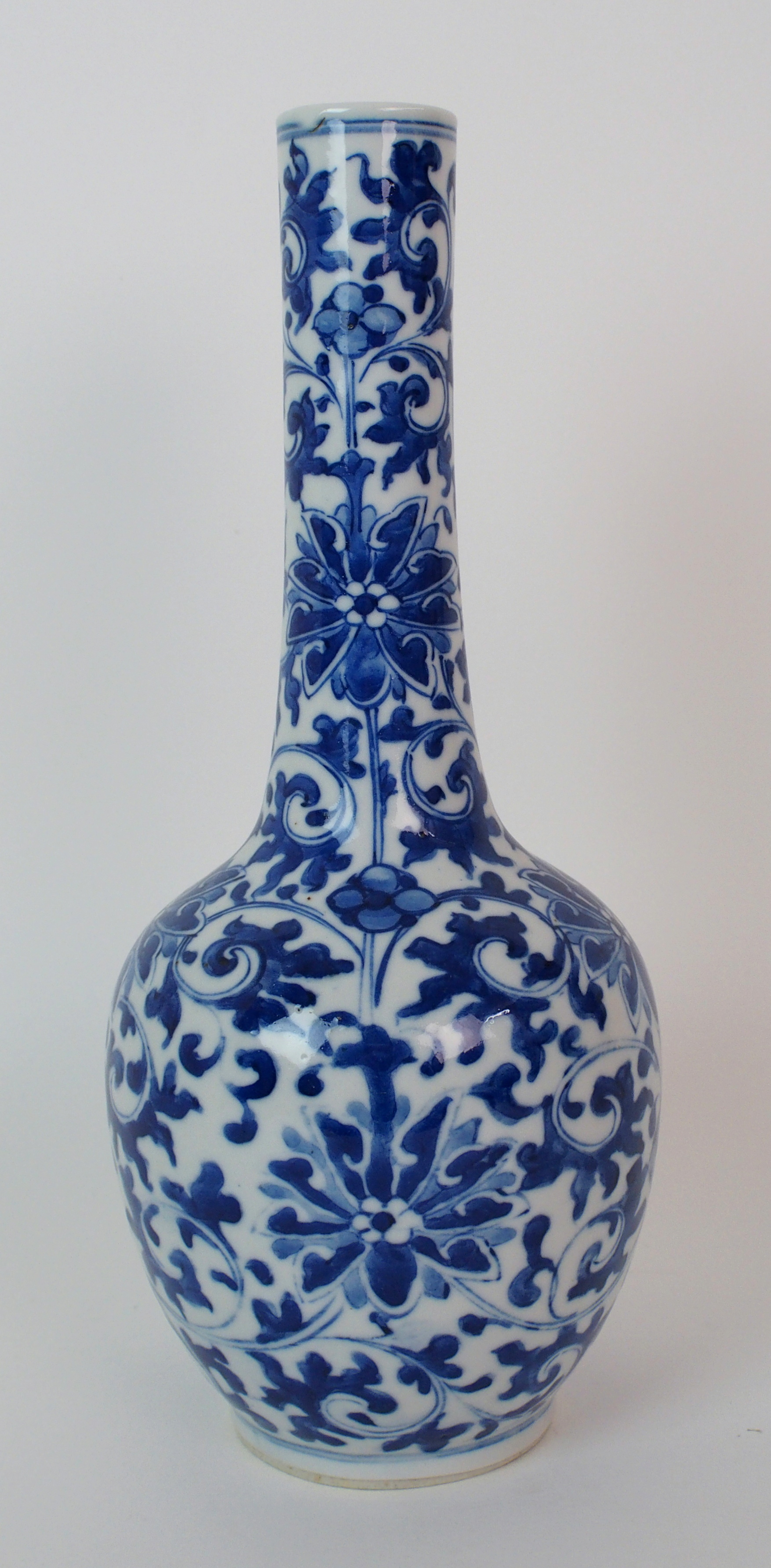 A Chinese blue and white bottle shaped vase painted with peonies and scrolling foliage, blue - Image 4 of 10