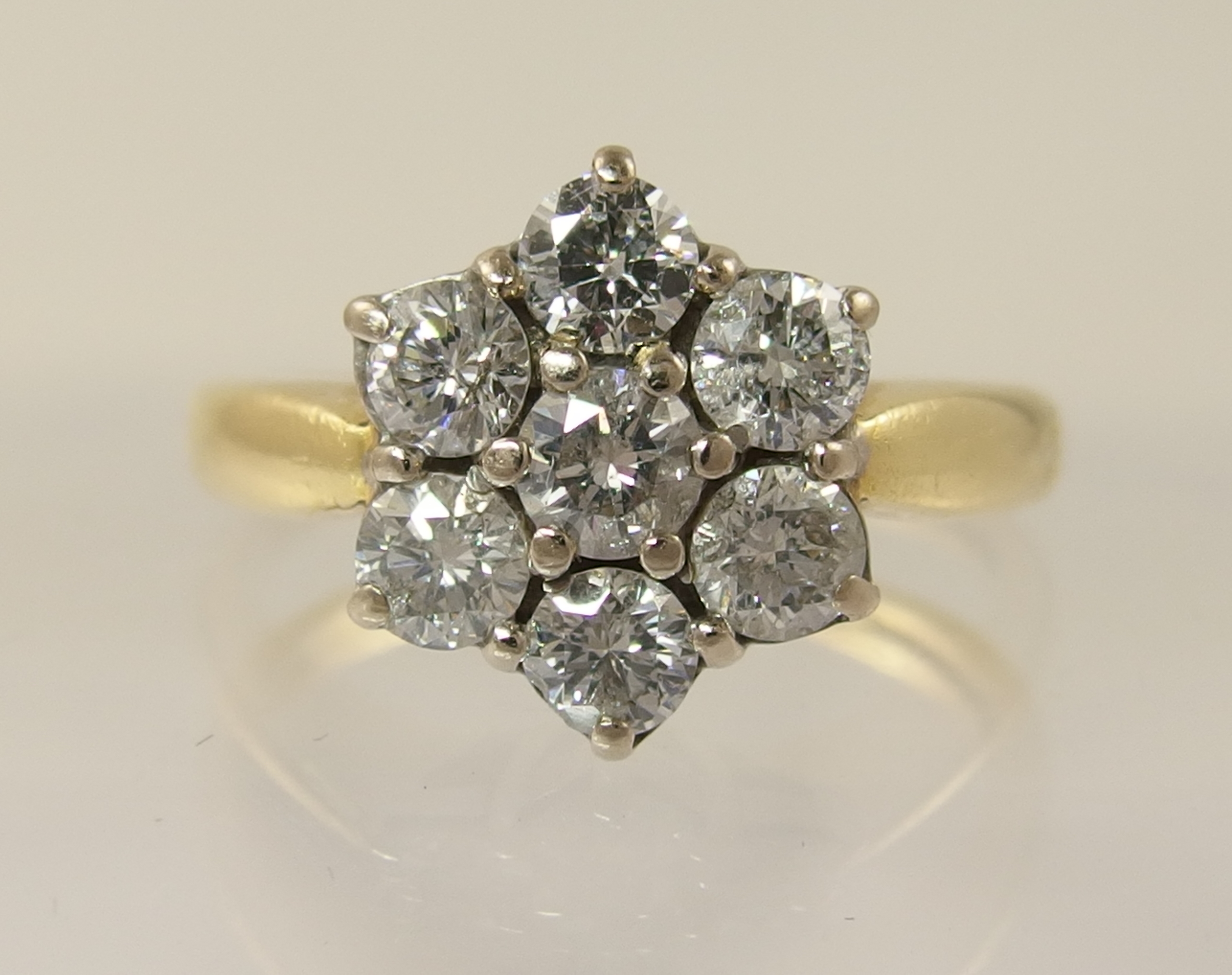 An 18ct diamond daisy cluster ring with an approximate diamond total of 0.80cts, finger size M. - Image 3 of 7