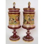 A pair of Viennese painted porcelain footed vases cylindrical-form with band of painted putti in