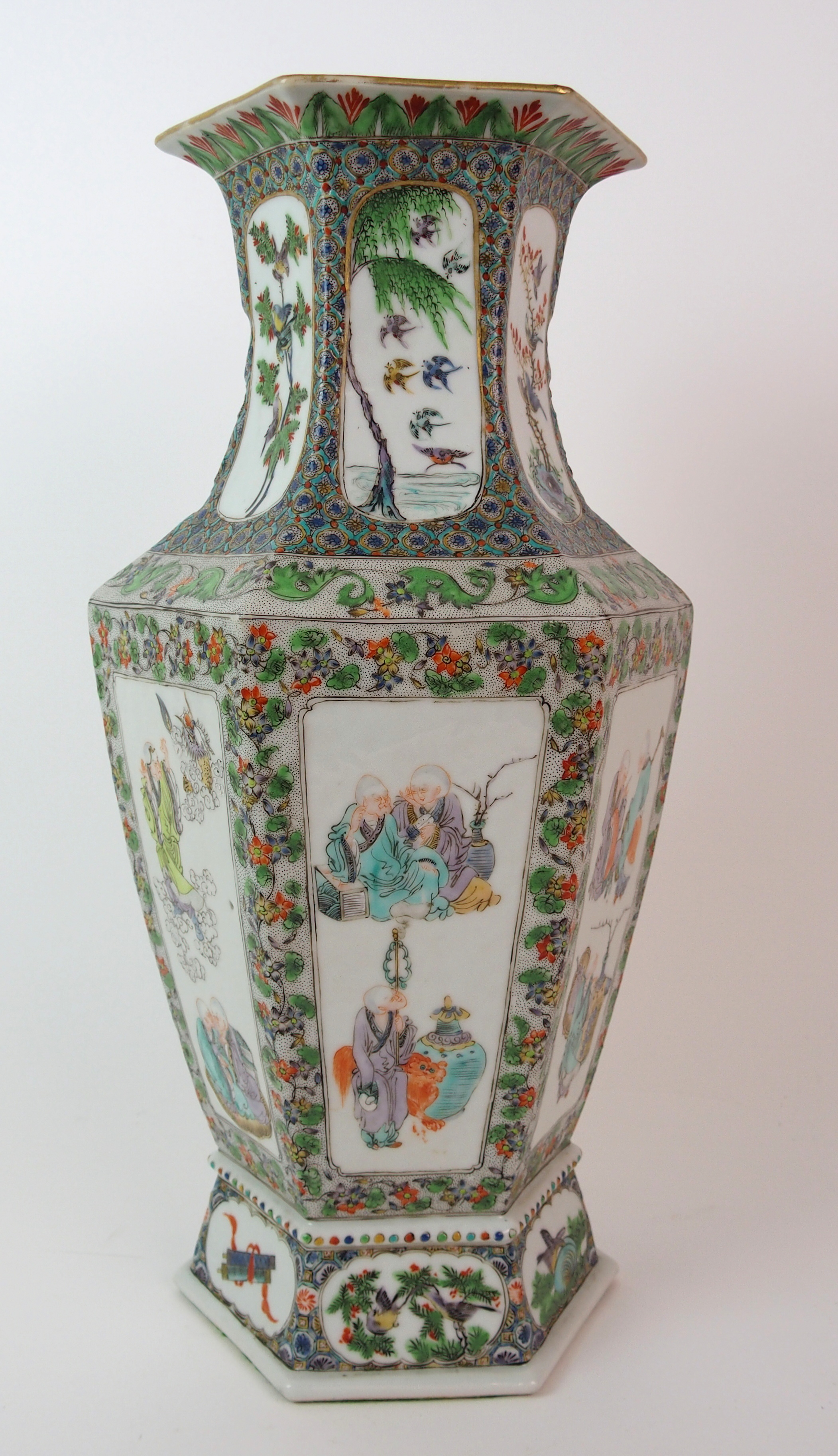 A Cantonese hexagonal tapering vase painted with panels of immortals within foliate and seed - Image 3 of 10