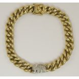 A 14ct curb chain bracelet with a diamond set elephant detail length approx 20cm, weight approx 58.