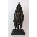 An Orientalist patinated cast bronze figure of a dancer depicting a female dancer with feet astride,