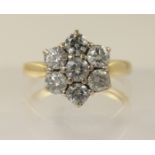 An 18ct diamond daisy cluster ring with an approximate diamond total of 0.80cts, finger size M.