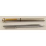 A Cartier pen in white brushed metal with tricolour gold rings to the top of the lid, gold