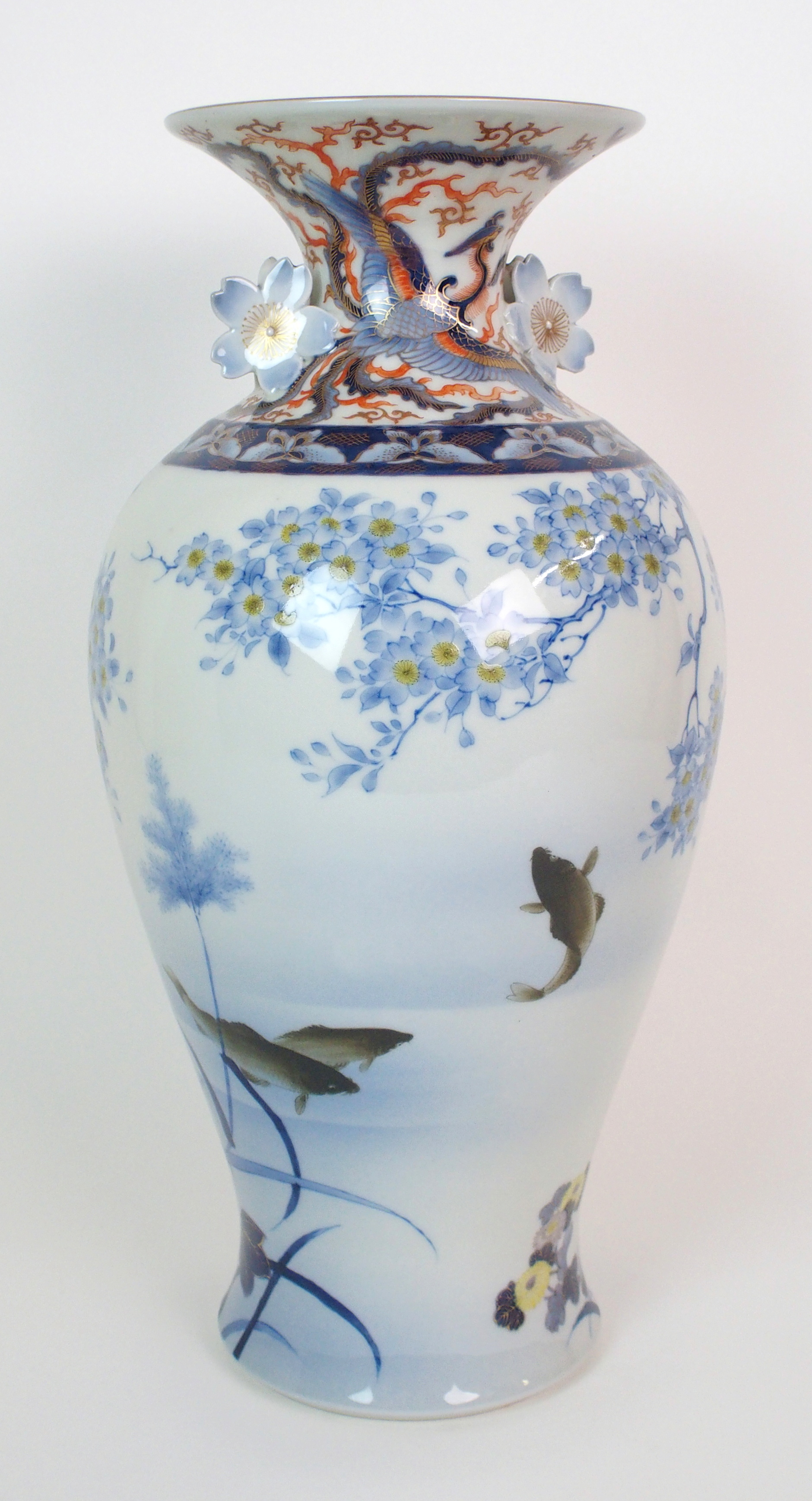 A Fukagawa baluster vase painted with fish beneath blossoming branches with Ho-o birds to neck and