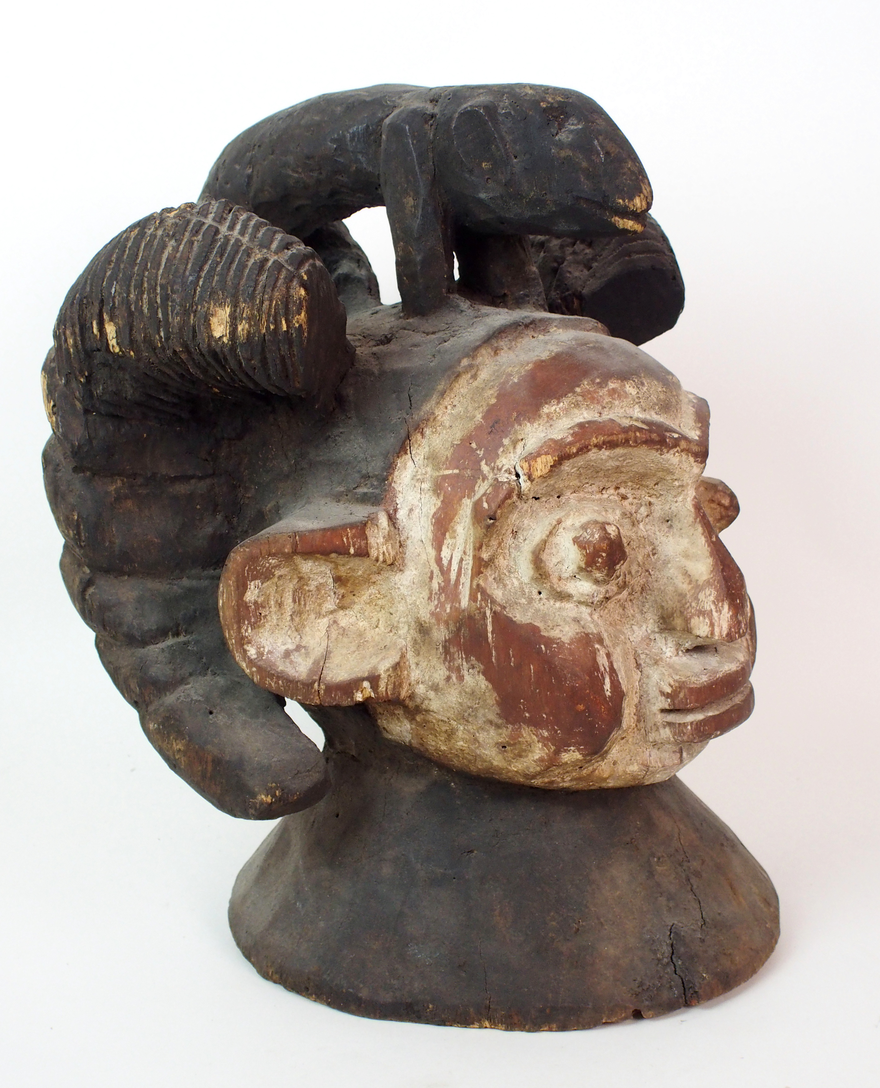 An African carved and painted wood mask with animal finial and scroll shaped ears, 38cm high - Image 2 of 10