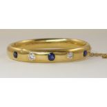 An 18ct diamond and blue gem set bangle circa 1885 this is a mourning piece with an inscription '