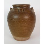 A Chinese russet glazed ribbed jar with four loop handles to neck beneath folded rim, 23cm high