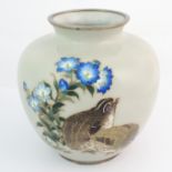 A Japanese cloisonne baluster vase decorated with a pair of quail beneath blue flowers on a duck egg