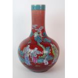 A Chinese flambe baluster polychrome vase painted with figures beneath a pine tree and bats and