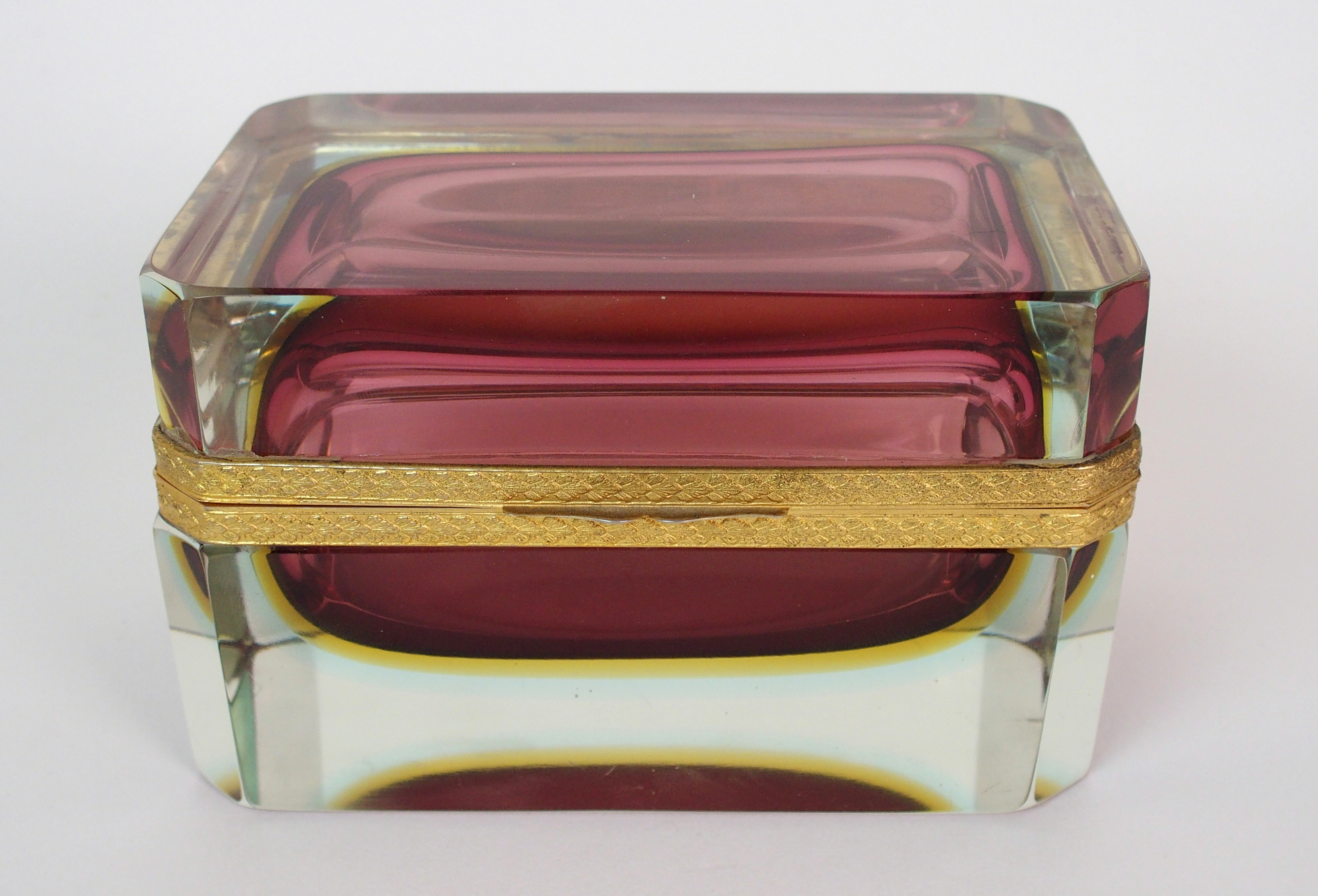 An Italian sommerso glass and gilt metal mounted table casket clear glass rectangular box with