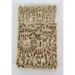 A Cantonese ivory card case densely carved with figures in pavilions beneath wisteria (section