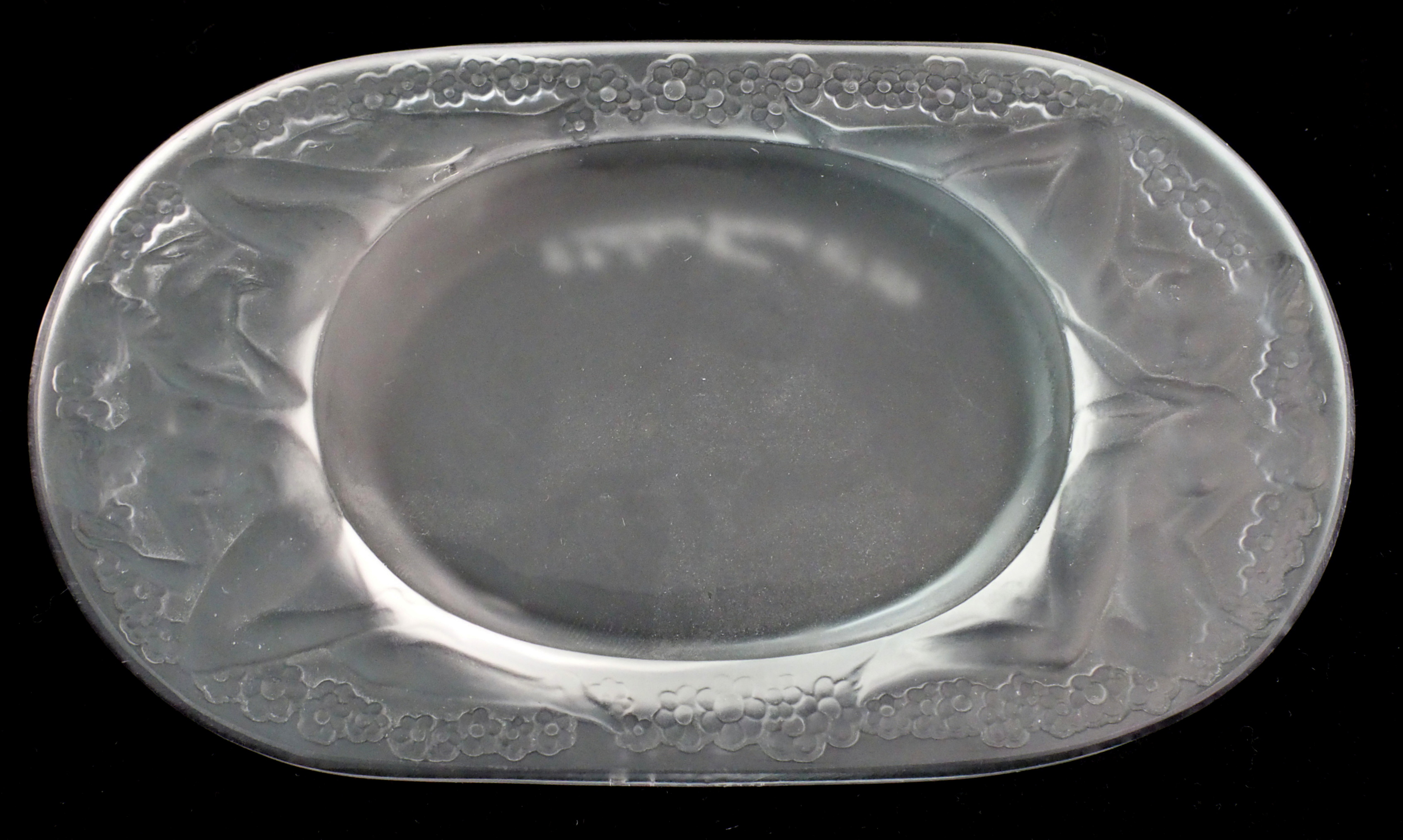 A Rene Lalique "Medicis" pattern moulded frosted glass ashtray circa 1924, oval dish with pair of