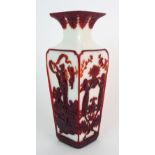 A Beijing glass square shaped vase the red overlay on white decoration carved with four panels of