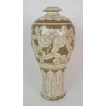 A Cizhou style Meiping vase carved with a broad band of peonies beneath a leaf band and above a