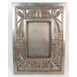 A Glasgow style rectangular metal table photograph frame cast and chased with ivy, 28 1/2 x 21cm