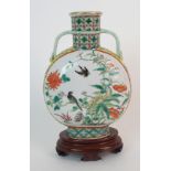 A Chinese famille verte two-handled Pilgrim vase painted with panels of birds amongst plants