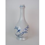 A Chinese blue and white baluster vase with garlic neck with six character mark above a pair of