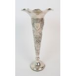 A Chinese silver spill vase embossed with birds and butterflies amongst chrysanthemums divided by