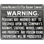 LMS enamel Trespass Sign, white lettering on black ground measuring 22in x 18in. Good colour and