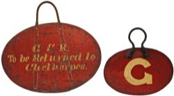Circular wooden board as fitted to locomotive lamp brackets 'Train Following'. Painted on rear '