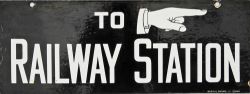 Enamel Sign 'To Railway Station' with right pointing finger. White on black with makers name