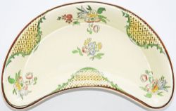 LMS Hotels kidney shaped glazed pottery Dish with ornate floral pattern. Measuring 8.5 inches by 5.5