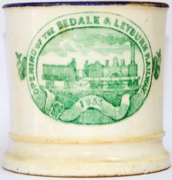 Early Earthenware Mug with a green image on side showing a 2-2-2 Locomotive and headed 'Opening Of