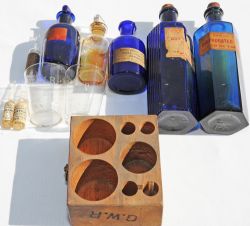 GWR Wooden medicine Bottle Holder, branded 'GWR'  with contents, most of which are marked on the