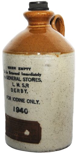 LMSR stoneware Iodine Bottle complete with stopper and original paper label affixed. Stands 9 inches