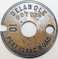 Single Line brass and steel Tablet DELABOLE - PORT ISAAC ROAD 10. Stamped 'Not IN Use' on the