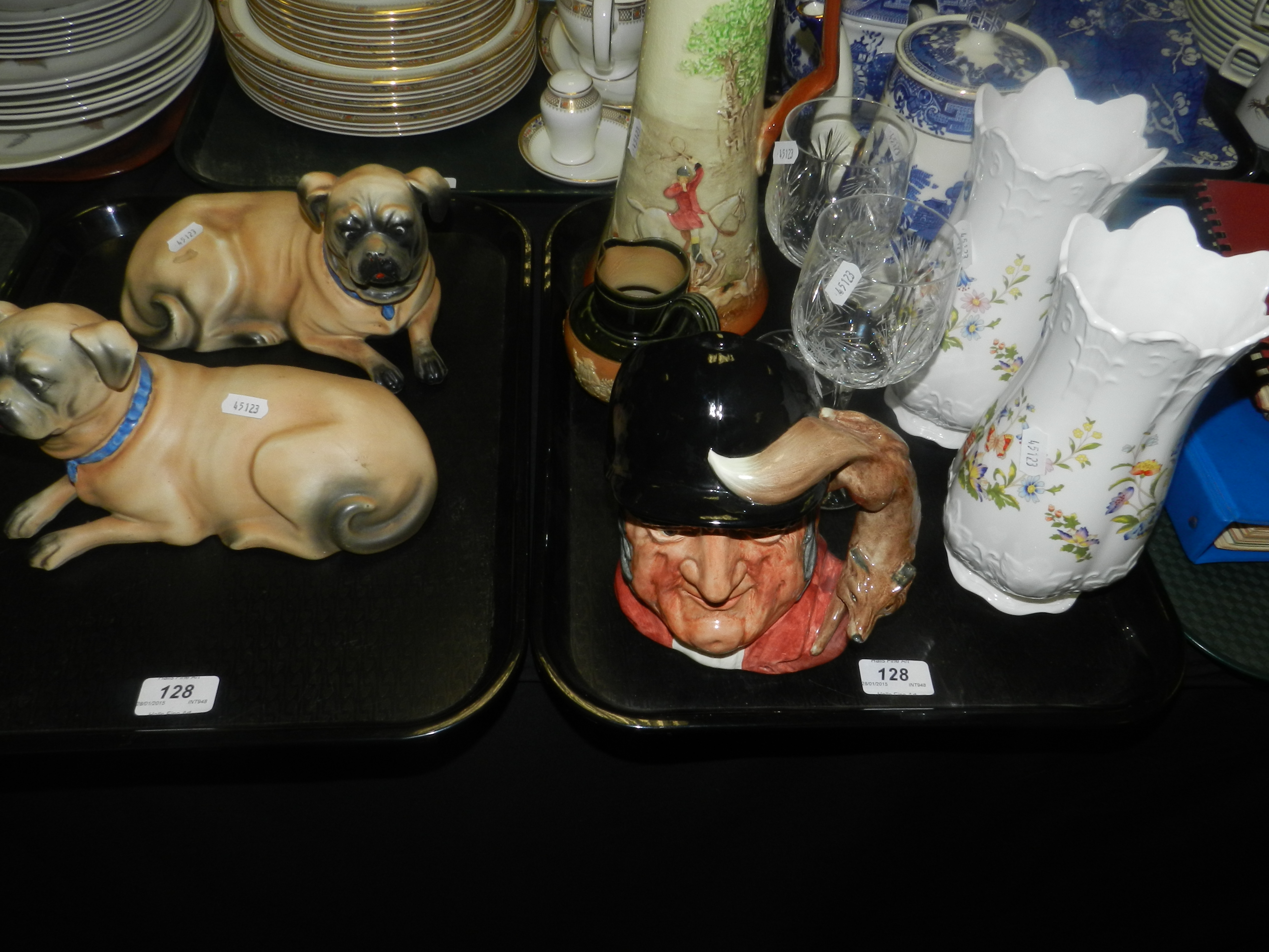 A pair of continental slip cast pugs, a