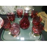 A cranberry glass decanter and stopper,