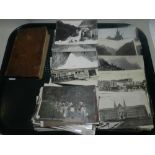 A quantity of postcards showing various