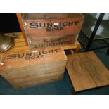 Three Sunlight Soap boxes, along with a