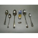 A collection of four silver spoons, toge