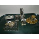 A collection of metal mounted inkwells,