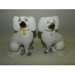 A matched pair of Staffordshire poodles,