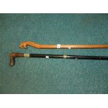 A sword stick, with carved hardwood hand
