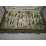 A cased set of twelve white metal teaspo