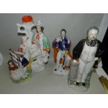 A group of three Staffordshire figures,