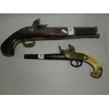 Two decorative wall pistols, to include