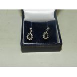 A pair of diamond and sapphire drop earr