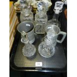 A group of glass decanters and stoppers