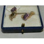 A pair of amethyst stylised clip earring